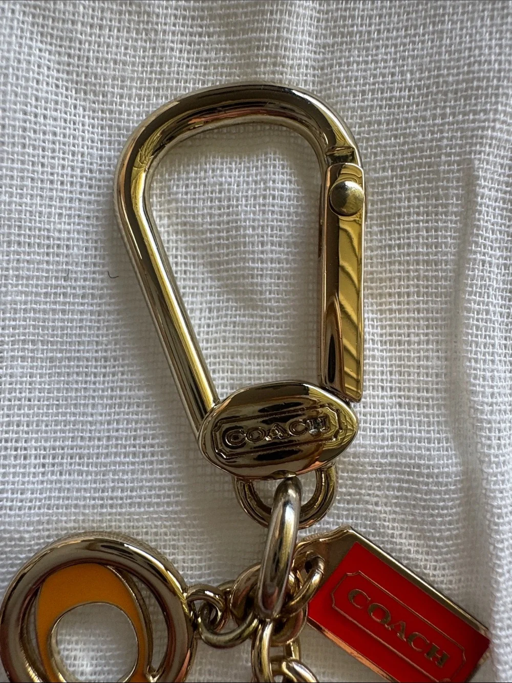 Coach Gold-Tone Multi Charm Keychain with Pink Heart and Red Tag